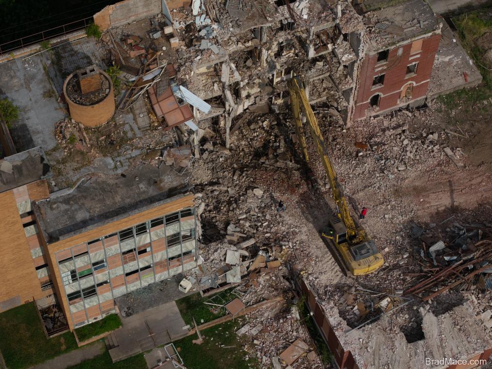 Multiple buildings in various stages of demolition